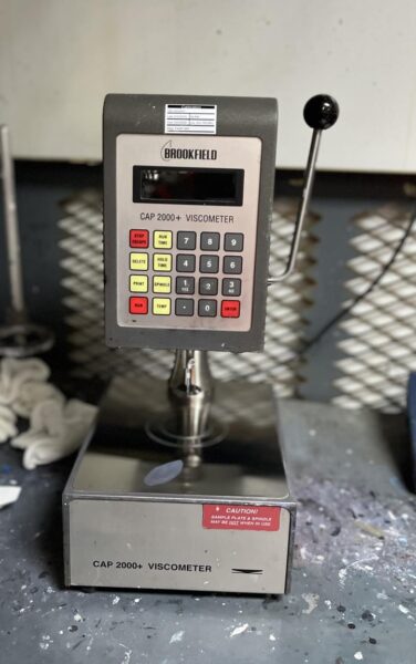 A Brookfield CAP 2000+ cone-and-plate viscometer in a paint mix room